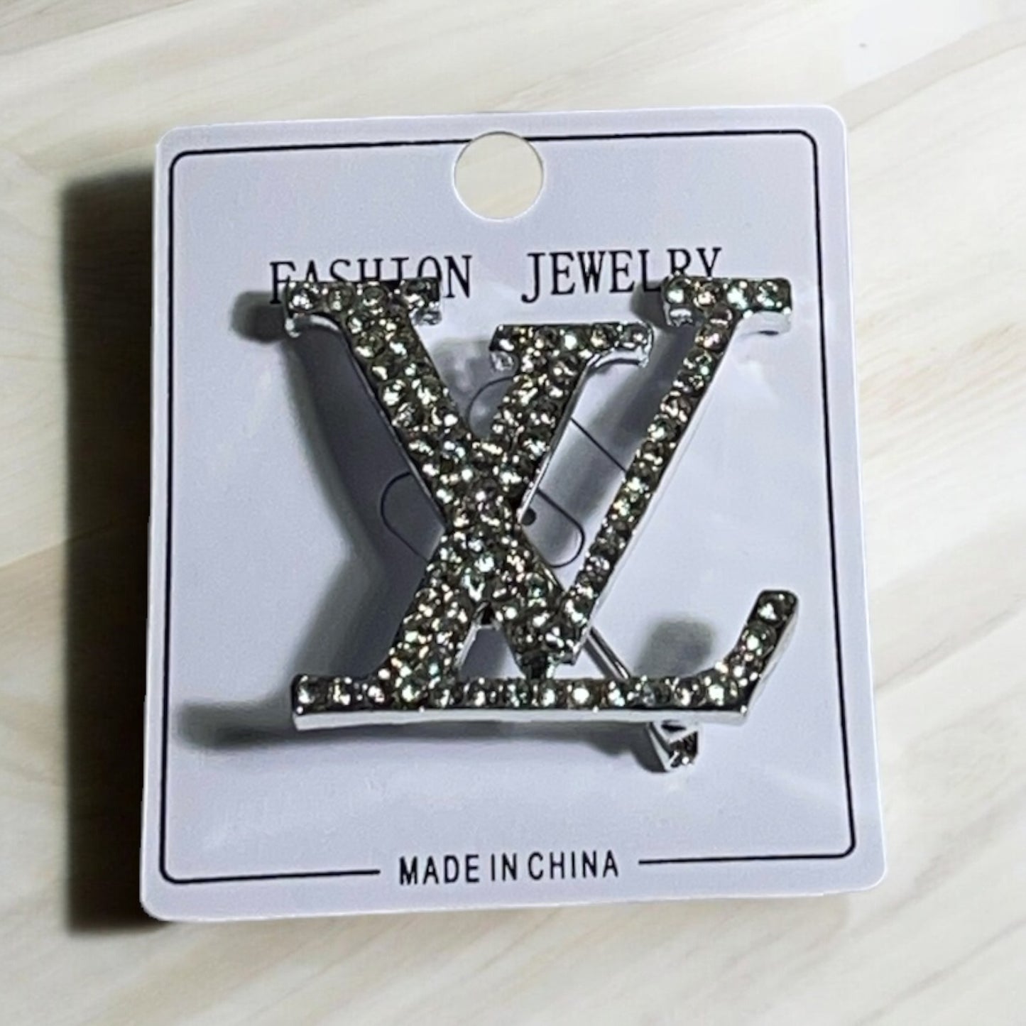 Silver LV Brooch